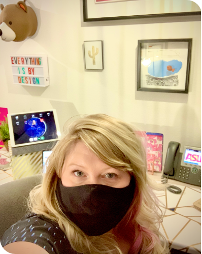 Carrasquilla in her office wearing a mask during the pandemic